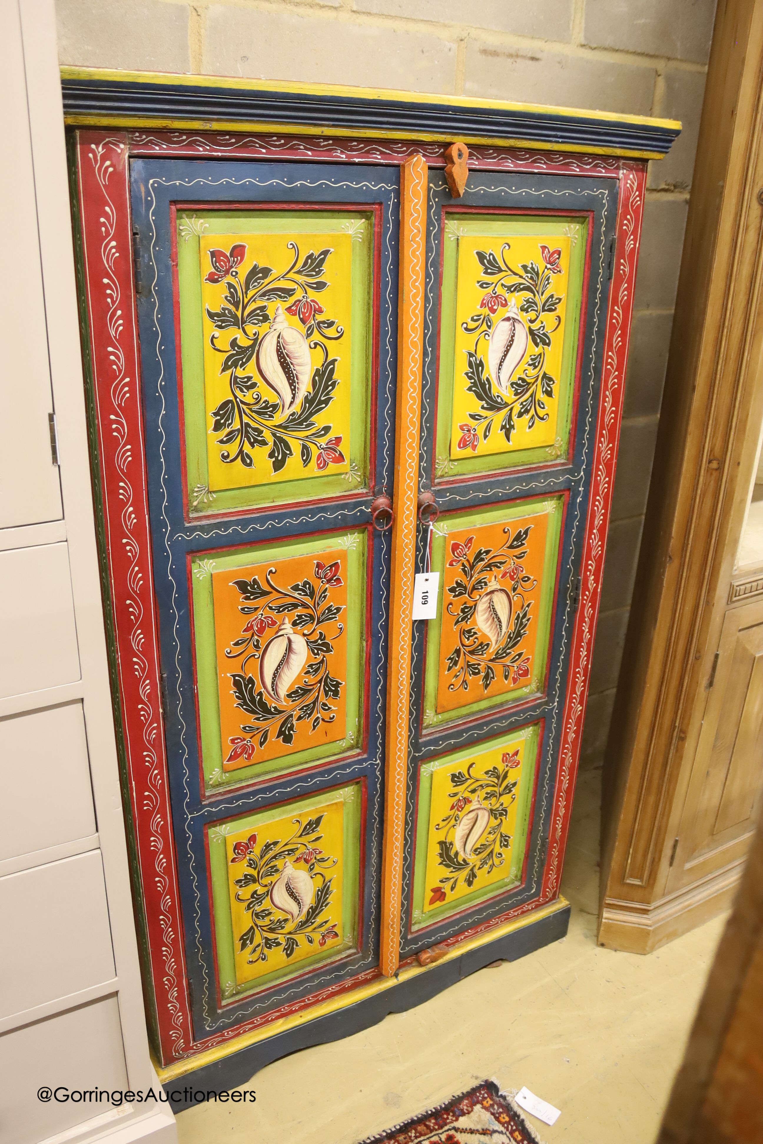 An Indian painted hardwood two door cabinet, width 85cm depth 38cm height 145cm